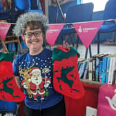 Tricia, organiser and Vice Chair of Friends of Castlecatt War Memorial Hall, with Christmas stockings. Credit National Lottery