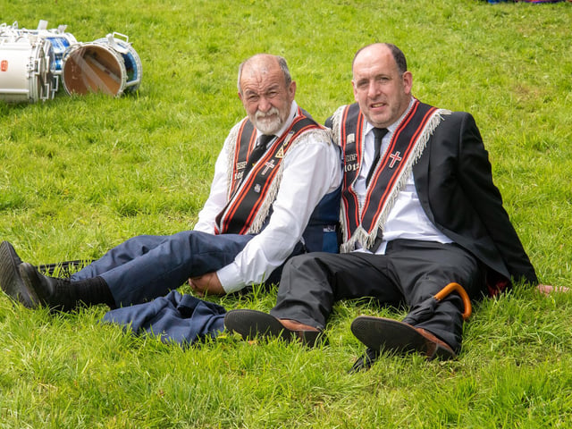Taking a well earned rest after parading at the field in Scarva are Robert Wilson, left, and Jonathan Pollock, both from Gilford. TH 115.