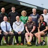 Chair of Mid-Ulster District Council pictured with Coaches and representatives from Radius Housing