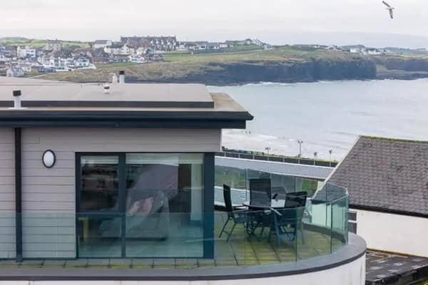 On the market with Armstrong Gordon property agents for offers over £645,000, this magnificent three bedroom penthouse apartment commands views of the Atlantic Ocean, Donegal headlands, Ramore Head, East Strand and across Portrush.  Constructed around 2019, the apartment features an entrance hall with part mirrored slide robes; an open plan kitchen/diner area with top-of-the-range appliances, and a lounge area with an electric fire set in a media wall with recess for flat screen TV.  There are three double bedrooms, one with an en-suite shower room, and a modern bathroom.  Externally the property benefits from a spacious balcony and private secure under-building parking.