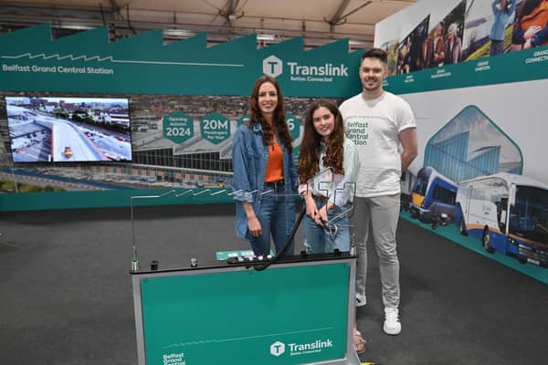 Pictured at Translink’s Grand Connection Roadshow are Jamie Brownlee, Team Translink, with bus and rail users, Catriona Mulhern and her daughter, Mia, from Belfast. The Grand Connection Roadshow will visit locations all over Northern Ireland, stopping at bus and train stations, plus community, leisure and shopping centres. Picture: Translink