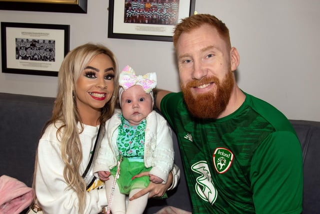 Happy family at the Tír Na nÓg GFC St Patrick's Day party including from left, Sarah McCaughley, Eivy (4 months) and dad, Fergal Beattie. PT12-230.