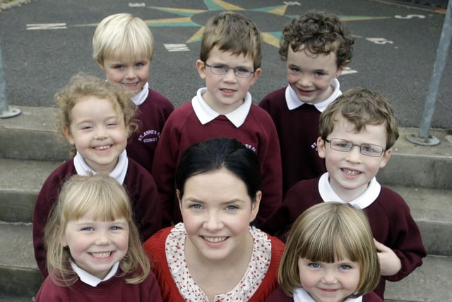 SUPER SEVEN. Teacher at St Anne's PS Corkey, Mrs Marron, pictured with P1's in 2009