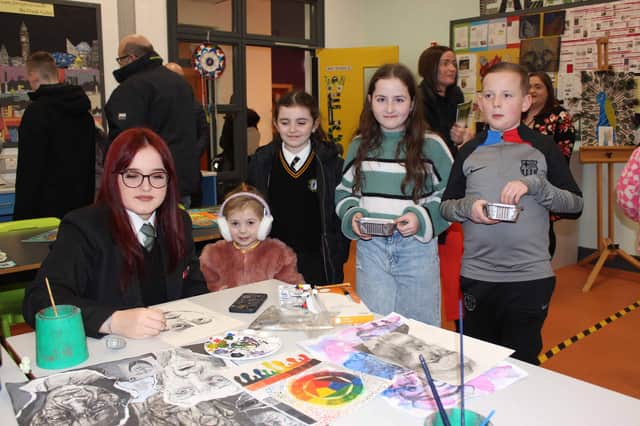 Rioghnach, Aoibheann, Odhran getting an art lesson from Ema 11CS
