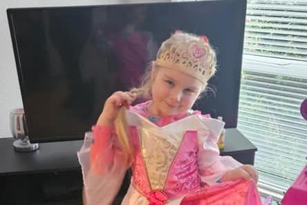 Cara dressed as Princess Aurora from Sleeping Beauty.