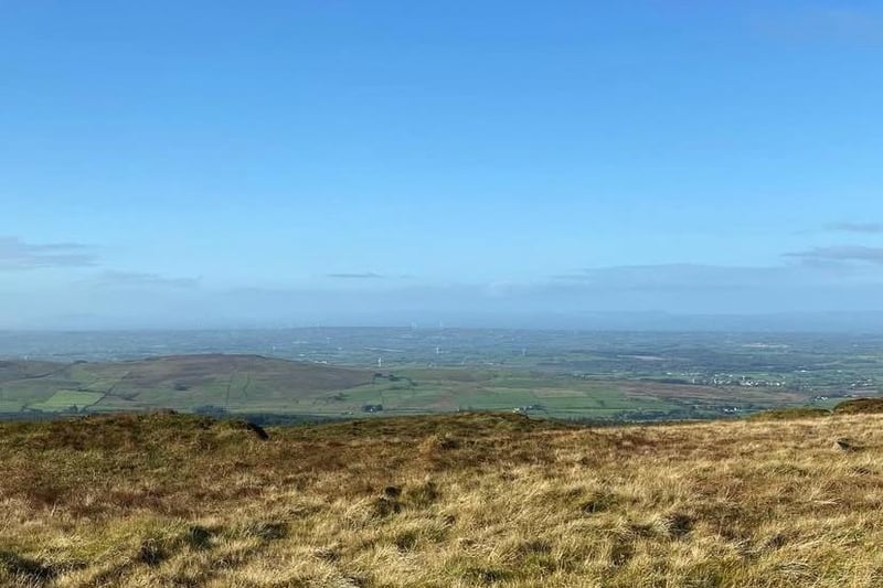Slieveanorra Mountain, also known as Slieve-na-Aura and Aura/Orra, is one of the many named peaks in the Glens of Antrim. It isn't the highest - that honour goes to Trostan - but it has views to rival any of its peers in the Antrim Plateau. On a clear day, anyone who hikes the short but steep trail from the Altarichard Road to the telecommunications mast at the summit will be treated to the spectacular vista in the above photo. The mountain gives its name to the Battle of Aura, fought between the MacDonnells against the McQuillans and O'Neills in the middle of the sixteenth century. In 1942, a US Air Force bomber crashed on the mountain, with a memorial to the eight servicemen who lost their lives erected at the site in 2014.