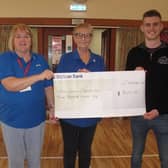 Everest Accountants & Financial Consultants recently donated £300 to Lisburn Dementia Care. Pictured are Janet Leathem volunteer, Maureen Doran, founder of the group and Aaron Dalzell of Everest Accountants. Pic credit: Lisburn Dementia Care