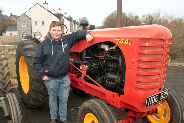 Joel Livingstone poses with his 1950s MF 744D tractor at the charity tractor run. PT12-276.