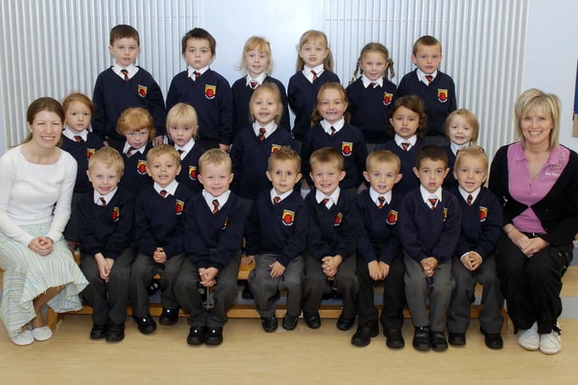 New P1 pupils at Orchard Primary School, Annaghmore pictured during their first days at school in 2007 with teacher Miss Hughes, left and classroom assistant Ms Winnie Winter.