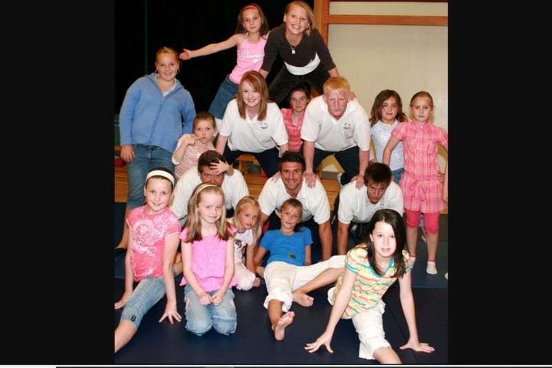 The children and leaders of the summer scheme having fun at Ulidia Integrated College in 2007.