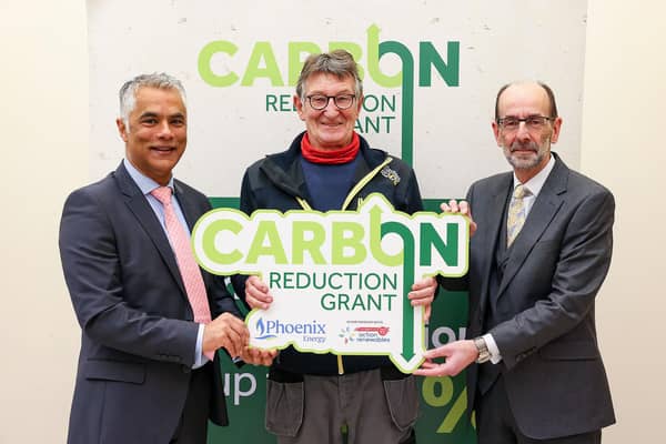 Kailash Chada (Chief Executive Officer at Phoenix Energy), Larne-based installer Derek Foster and Terry Waugh (Chief Executive Officer at Action Renewables). (Pic: Justin Kernoghan).