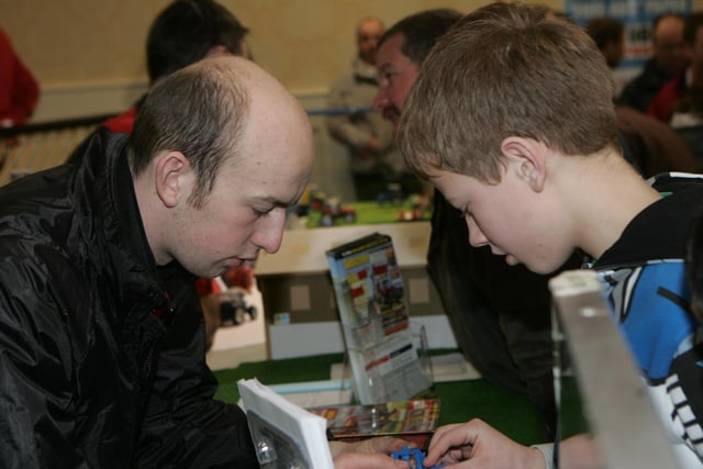 Looking in fine detail with Paul Morrison during the Extra Northern Irland Farm Toy and Model Show in the Magherabuoy Hotel Portrush  in 2011