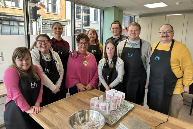 Triangle Housing Association’s service users and staff of Harmony Studio alongside Mayor of Mid and East Antrim Council Alderman Gerardine Mulvenna. Credit Naked PR