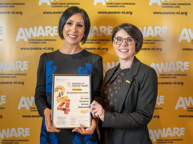 A representative from St Louis Grammar in Ballymena collects their accolade at AWARE NI's Investors in Mental Health Awards. The Cullybackey Road school was one of two Ballymena-based schools recognised for their dedication to promoting positive mental health, alongside Ballymena Academy. These schools integrated AWARE NI’s mental health programmes such as Mood Matters for Young People into their curriculum and maintained a consistent focus on mental health through initiatives like signposting, appointing mental health champions and creating dedicated mental health spaces.