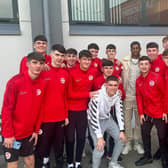 Marcus Rashford with young athletes at the Larne Academy of Sport. (Pic: Larne FC).