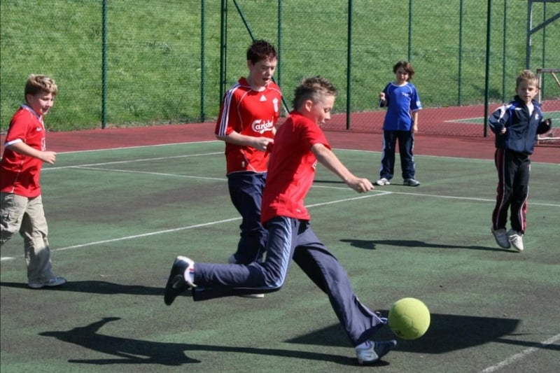Playing football during the Carrickfergus summer scheme at Ulidia in 2007.