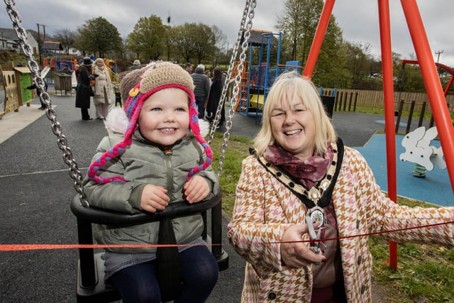 Deputy Mayor of Causeway Coast and Glens, Councillor Margaret Anne McKillop cuts the ribbon to officially open the refurbished Armoy Playpark with Maddie McCooke from Armoy