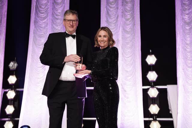 Robin Black, Head of Strategic Development at Brett Martin picking up the award for Green/ Sustainable Company of the Year category sponsored by Strategic Power Group presented by Ruth Kimbley, Strategic Power Group Communications Director. (Pic: Press Eye).