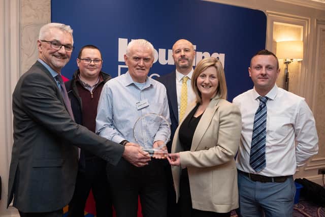 Pictured, from left, Chris Welch, Chair of Asset Management committee presents winners, David Black, Kieran Adams, George Stanfield and Stephen Sherry, winners of the Housing Executive Health & Safety Contractor of the Year Award 2023 for Response Maintenance, along with the Housing Executive’s Chief Executive Grainia Long.