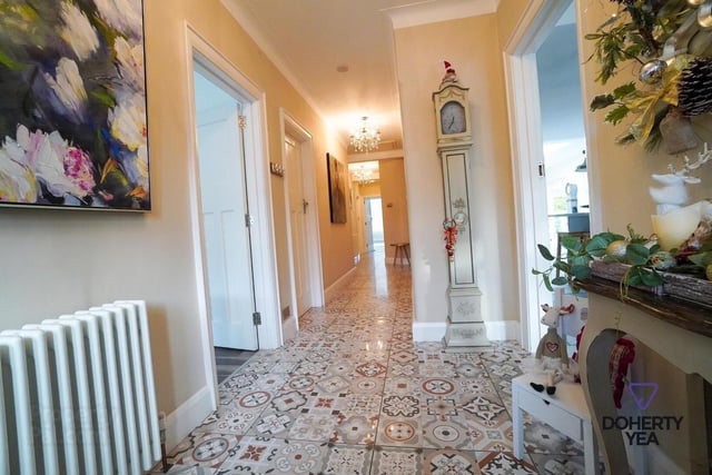Entrance hall with mosaic tiled floor.