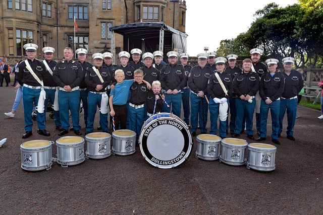 Members of the Star Of The North Flute Band, Dollingstown posing proudly in their new uniforms which they wore for the first time at the Lurgan mini 12th parade on Friday evening. LM27-255.