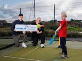 Power NI’s Myles Grant, Templepatrick Cricket Club coach David Caldwell and member Archie Caldwell