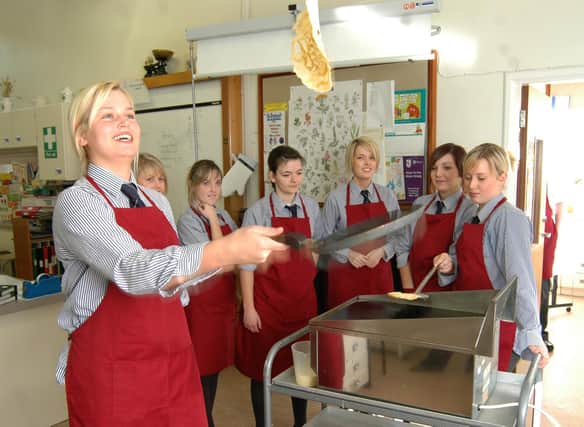 Katie Saunderson successfully flips a pancake on Shrove Tuesday during domestic science at Larne Grammar School in 2007.