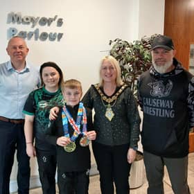 Leon Williamson pictured with Mayor of Causeway Coast and Glens, Councillor Dawn Huggins, his mum, Melanie and coach Peter McClay from Team Ryano Causeway, also included is Councillor Philip Anderson.