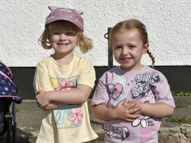 These two young ladies are enjoying the bands and sunshine on the Malcom Road, Lurgan.