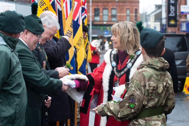 Lord Mayor of ABC Council, Alderman Margaret Tinsley hands out sprigs of shamrock before the RBL St Patrick's Day parade on Saturday. PT12-203.