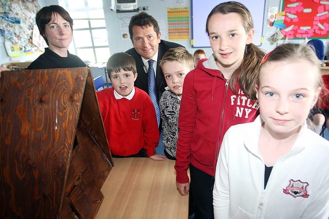 Ballymacward Primary School pupils John Maguire, Pearce Rainey, Ciara Beth Neale and Meghan Skillen pictured with Maeve Rafferty of the Wildlife Trust and Tony Monaghan of Bombardier donating an owl's nest to Ballymacward Primary School in 2009