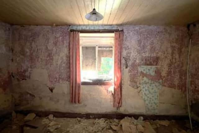 A structural survey report, submitted with the planning application, gives a measure of the poor condition of the listed cottage. Photo: Design ID