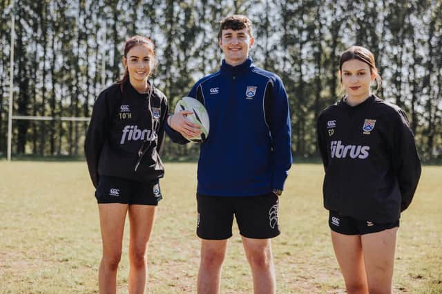 Coleraine Rugby Club’s Jonny Diamond (centre) is leading the charge in the club’s Girls’ Youth Rugby section. Pictured alongside Tillie O’Hara and Eva Draycott, his role as female rugby convener has many facets, including organising weekly training sessions for the U14 and U16 teams. Credit David Cavan