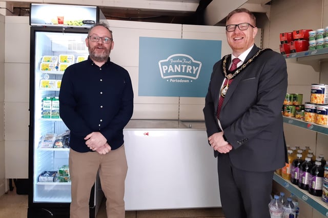Lord Mayor of Armagh, Banbridge and Craigavon Council Paul Greenfield at the fully stocked new social supermarket Freedom Foods Pantry in Portadown, Co Armagh on Thursday. He is pictured with Chris Leech who is chairman of the Craigavon Area Food Bank and those who have helped establish the facility. The supermarket is open to anyone in need and, for a small fee, can avail of a grocery shop of fresh and frozen food plus other staples.