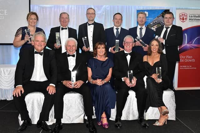 The prizewinners at the 2023 Mid-Ulster Business Awards which were held in the Royal Hotel, Cookstown. Also included are, compere, Adrian Logan, front left, and Julie McKeown, front centre, of main sponsors, Henry Brothers. Credit: Tony Hendro