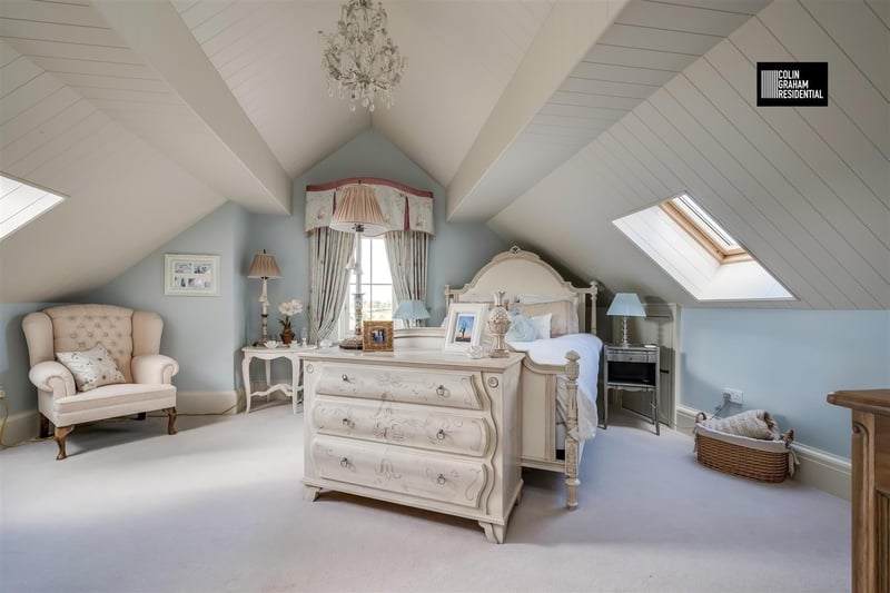 Bedroom with timber panelled vaulted ceiling.