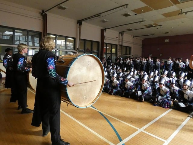 Clover percussion section members try out the lambeg drums during the workshop in Larne High School.