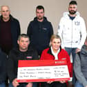 Members of Mosside Tractor Group presented a cheque over to Caroline Smith from Northern Ireland Air Ambulance. CREDIT KEVIN MCAULEY