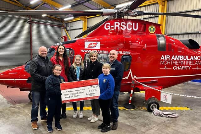 Representatives from The Resurgam Trust presented a cheque for £7700 to the Air Ambulance. Pic credit: Resurgam Trust