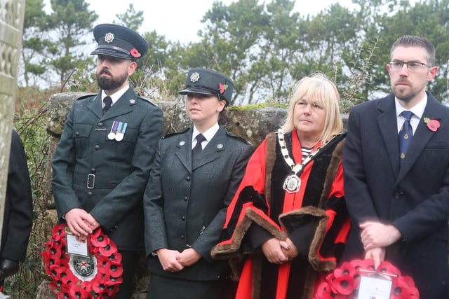 Insp Brogan and Const O'Connor representing the PSNI and Deputy Mayor Cllr Margaret Anne McKillop and James Mills of Causeway Coast and Glens Council  at Remembrance Sunday at the war graves at Bonamargy Friary.