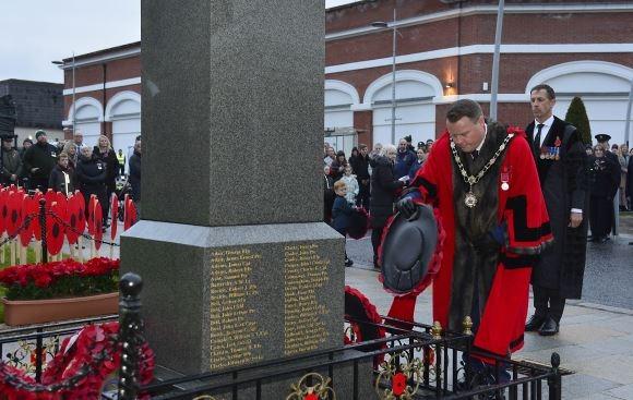Cllr Mark Cooper pictured at the act of remembrance at the War Memorial, Market Square, Antrim.