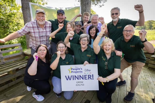 Alison McCloskey with staff, volunteers and the founders of Ashes to Gold.