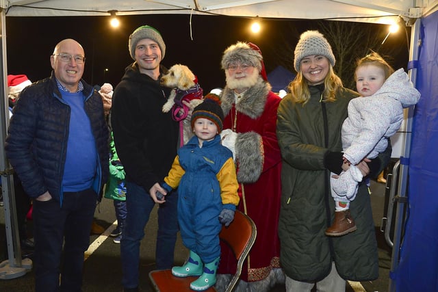 Councillor John Laverty with the Bradley family and Santa at the Carryduff Christmas Market