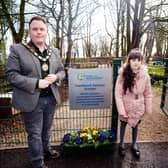 Rosstulla pupil, Arianna Radcliffe and Antrim and Newtownabbey Mayor, Councillor Mark Cooper BEM at the relocated Hazelbank Sensory Garden in Newtownabbey. Pic supplied by Antrim and Newtownabbey Borough Council