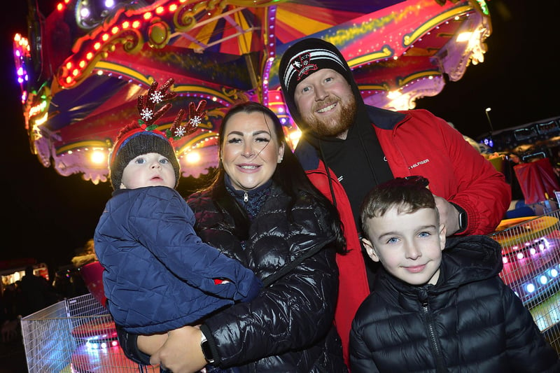 Mum and dad, Gena and Conor treating kids Eoghan and Donal to the Christmas festivities in Crumlin.