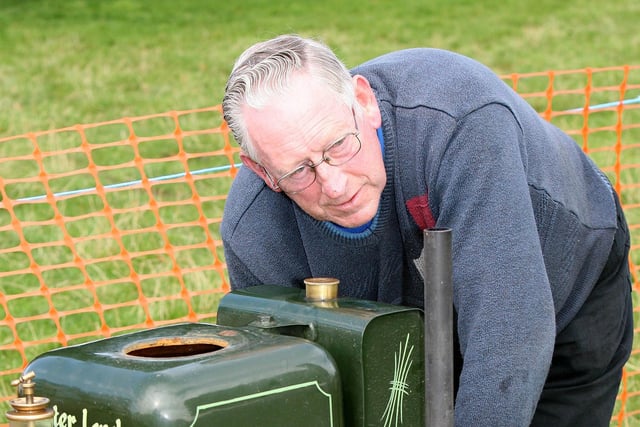 LITTLE BIT OF MAINTENANCE...Joe Scott working on his engine during the Garvagh Clydesdale and Vintage Show in 2008