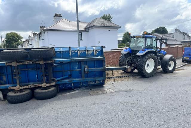 A trailer has tipped over shedding its load of wood chips at Flush Place Lurgan, Co Armagh.