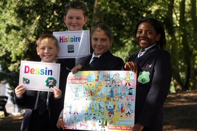 Fort Hill College Year 8 pupils Kyle Kenny, Chloe Higginson, Numa Zemba and Adam Higginson with posters and songs which they put up around the school to mark European Day of Languages in 2006