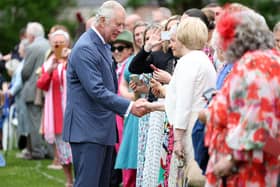 King Charles and Queen Camilla meet guests at Hillsborough Castle.