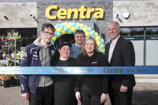 Anna and Frank McPolin (centre) with their son Eoin and daughter Sharon, who are co-owners of the store, with Paddy Murney, Retail Sales Director for Musgrave NI.